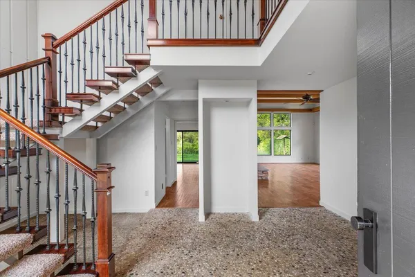a view of livingroom with furniture a fireplace and wooden floor