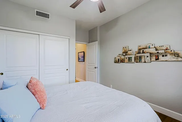 an aerial view of multiple houses with a yard