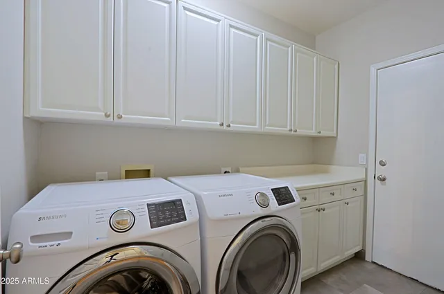 a house that has a tree in front of it