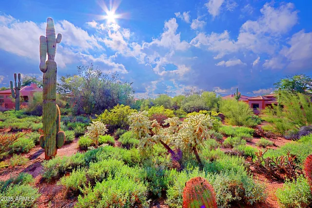 a living room with furniture a rug and a chandelier