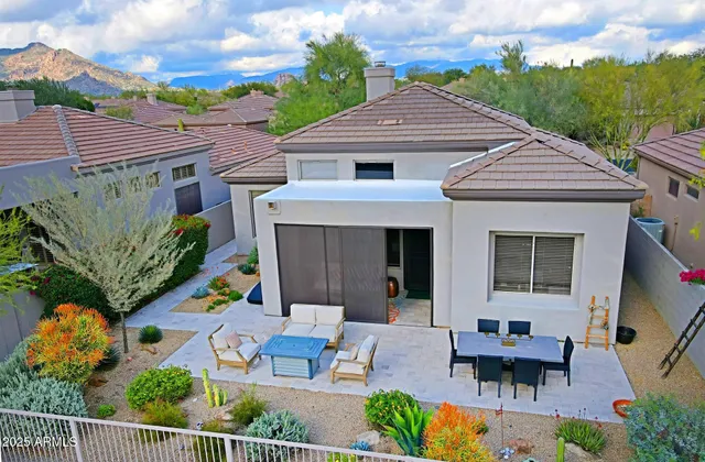 a living room with furniture and a book shelf