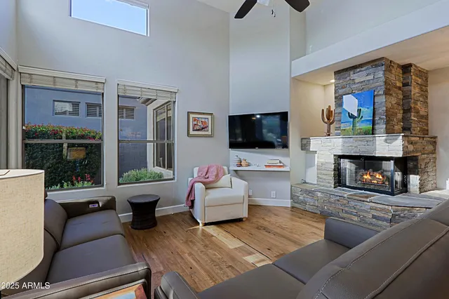 a living room with furniture and a fireplace