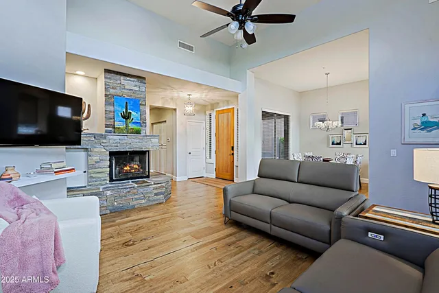a living room with furniture and a fireplace