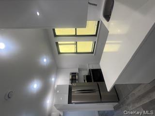 30-32 33rd Street Queens, NY 11102 - Photo 2 of 5 a kitchen with a refrigerator and a sink