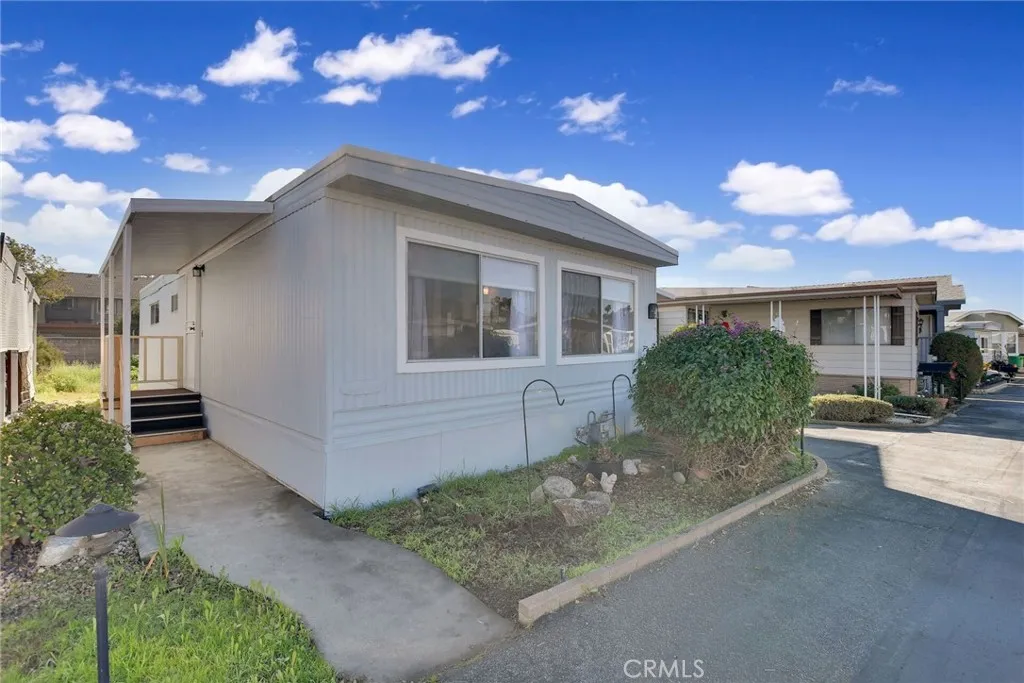840 Foothill, Unit 27 Azusa, CA 91702 - Photo 2 of 30 a view of a house with a yard