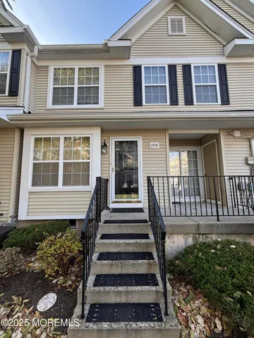 a front view of a house with a porch
