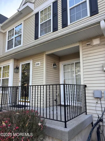 a view of a white building from a balcony