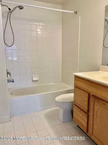 a bathroom with a sink a toilet and a bathtub