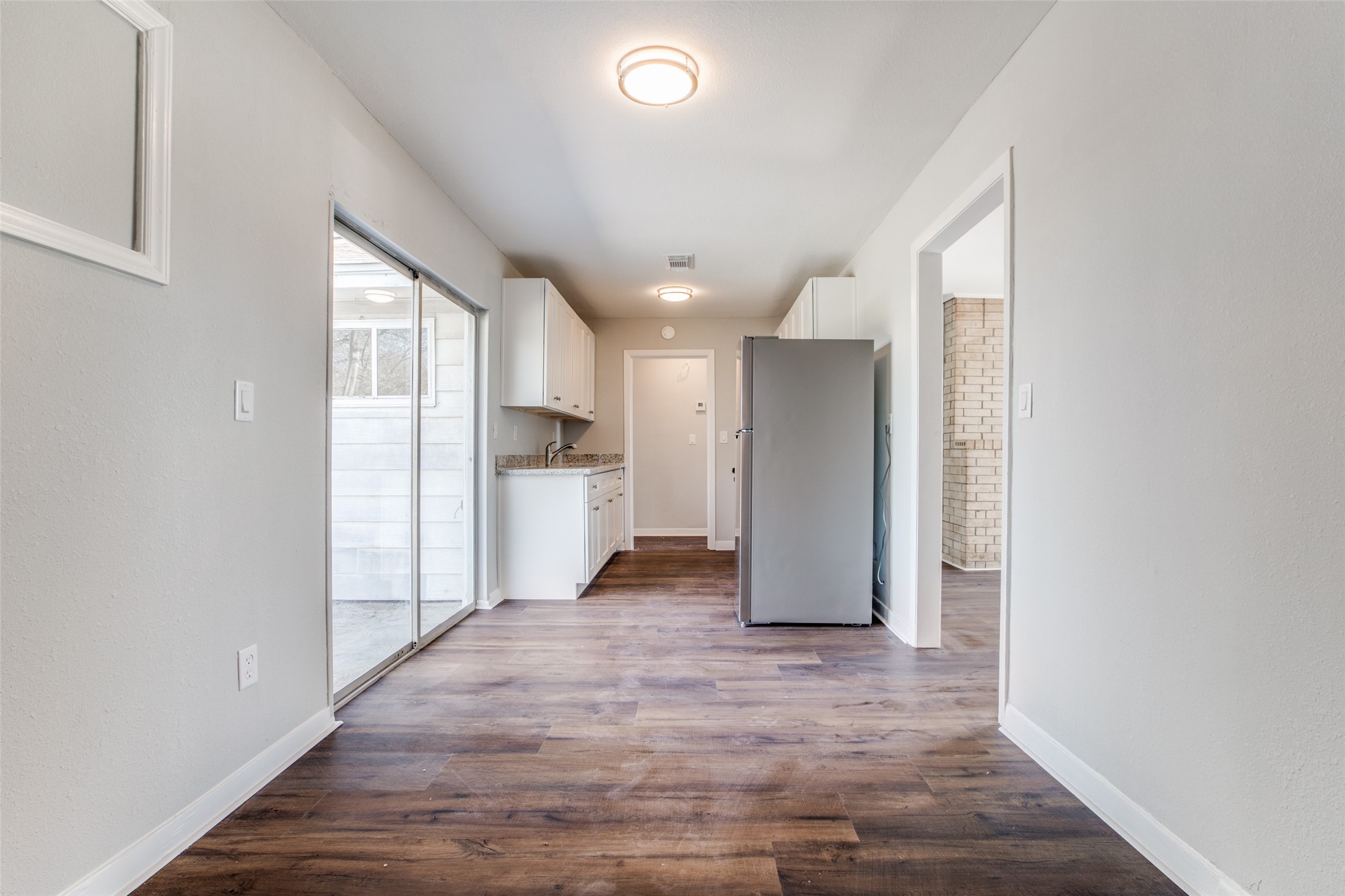 8615 Josie Street Houston, TX 77029 - Photo 15 of 25 a view of a kitchen with refrigerator and a sink