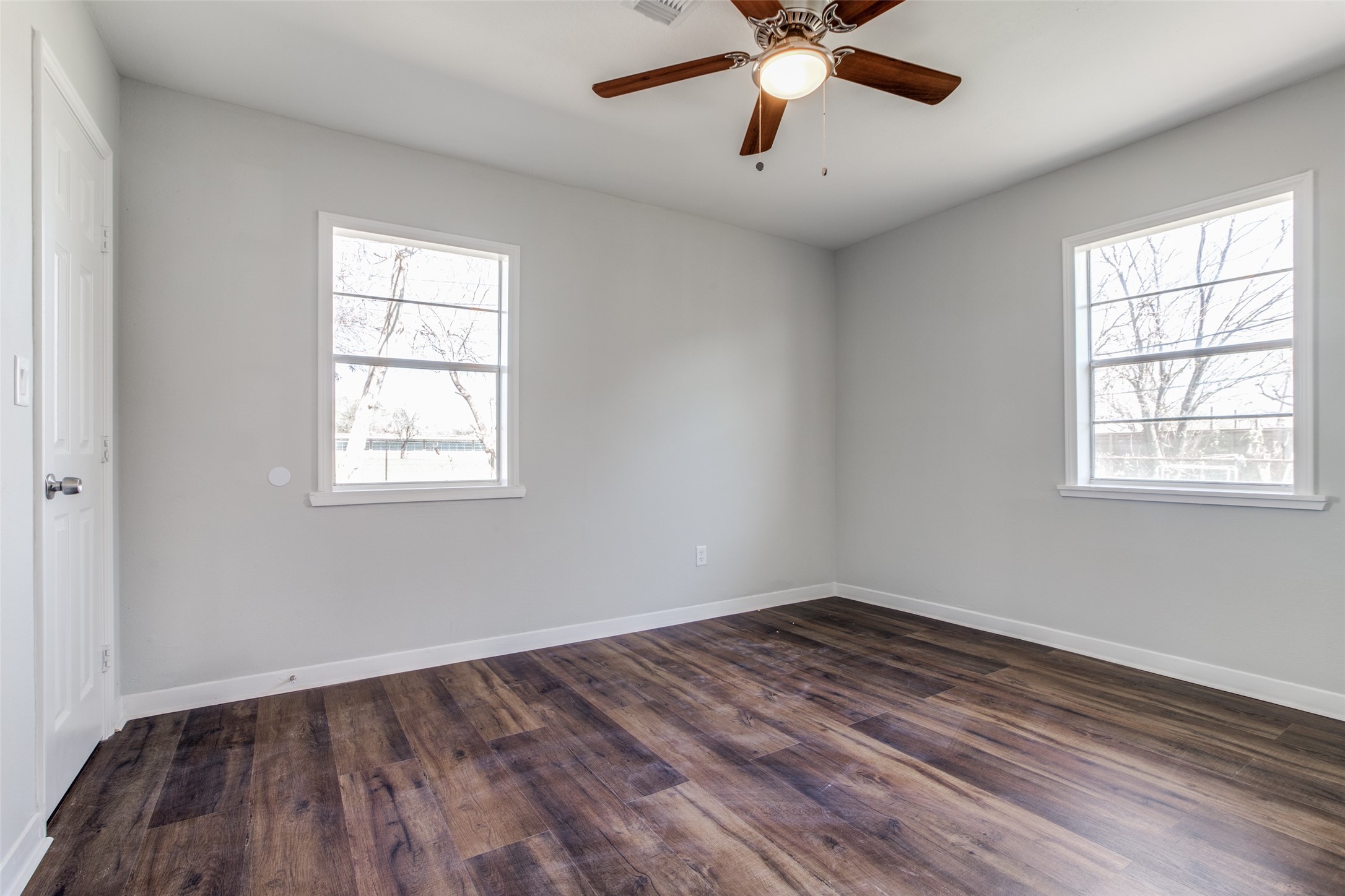 8615 Josie Street Houston, TX 77029 - Photo 19 of 25 an empty room with a window and a fan