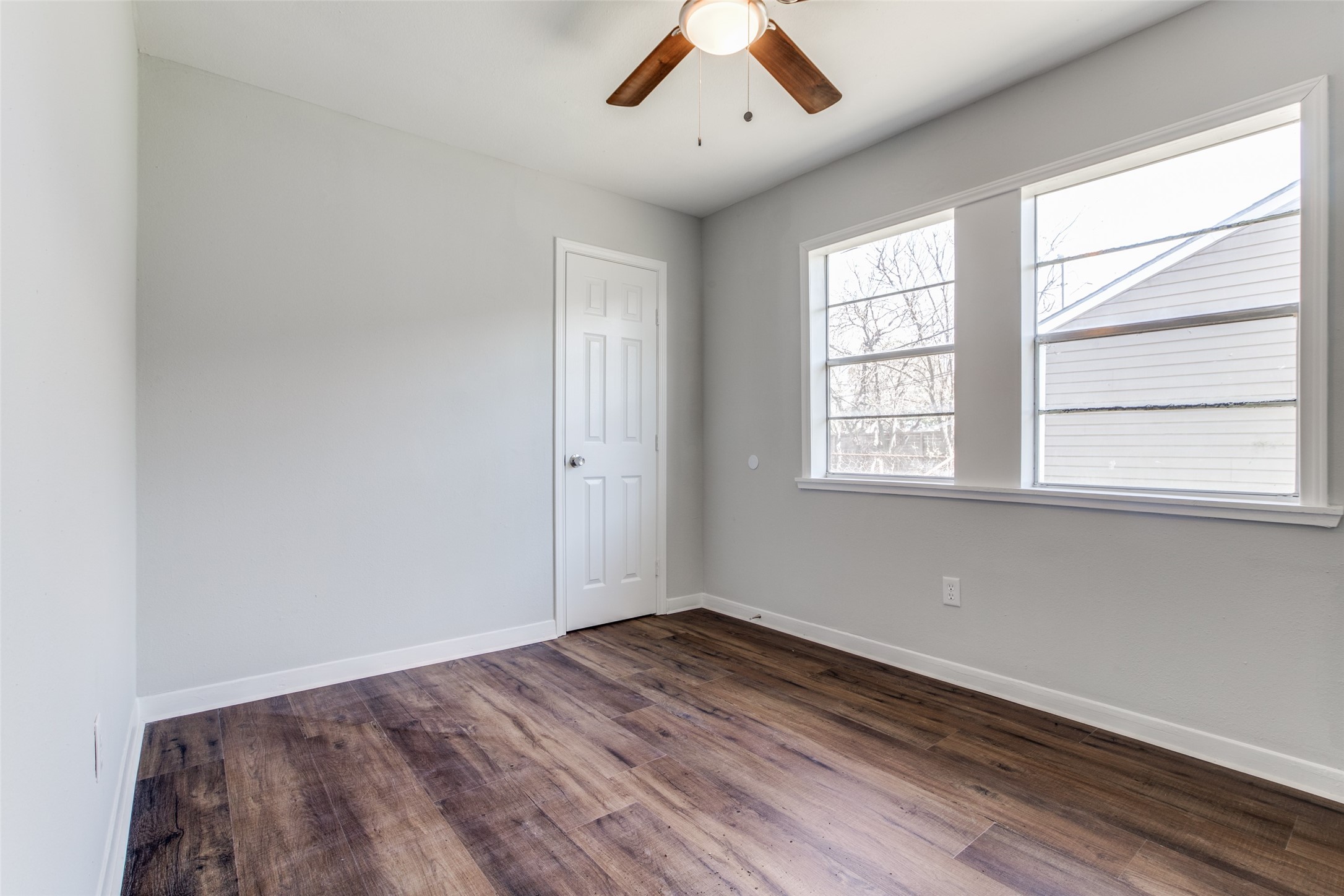 8615 Josie Street Houston, TX 77029 - Photo 20 of 25 an empty room with wooden floor and windows