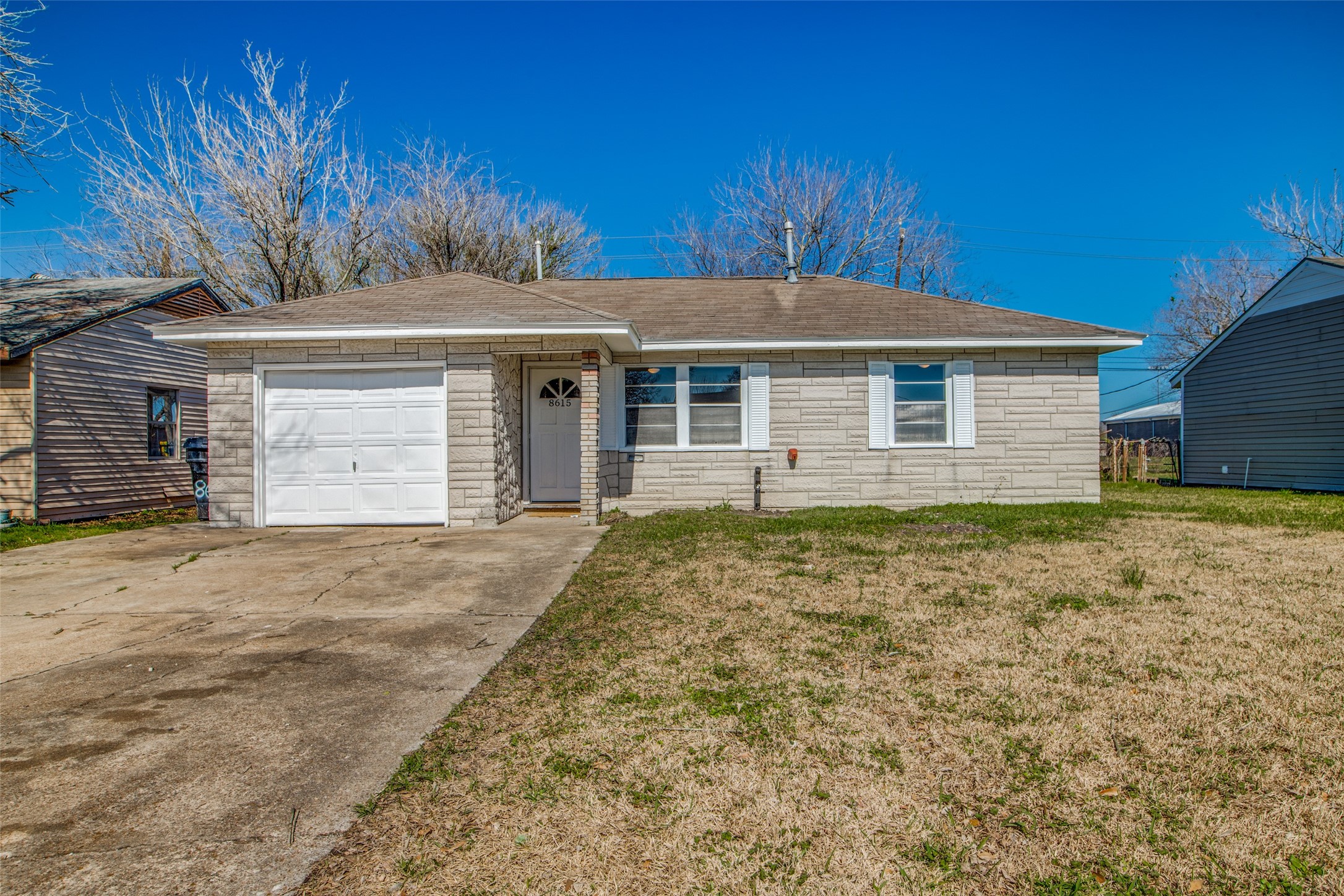 8615 Josie Street Houston, TX 77029 - Photo 2 of 25 a front view of a house with a yard