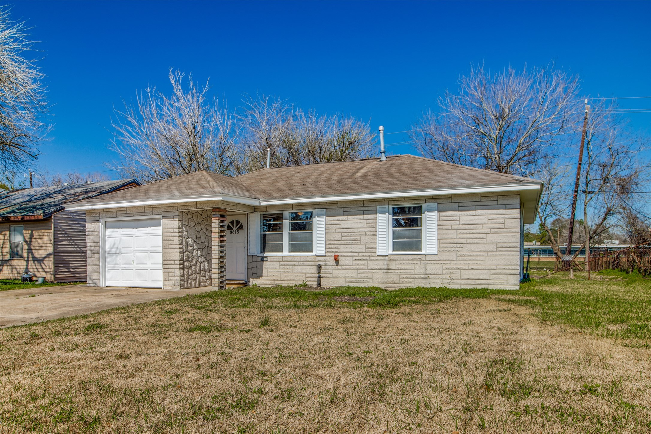 8615 Josie Street Houston, TX 77029 - Photo 3 of 25 a front view of a house with a yard