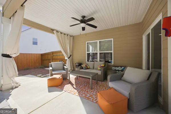 a outdoor space with patio the couches and pool table and chairs