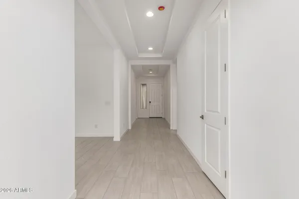 an empty room with sliding glass door and glass door