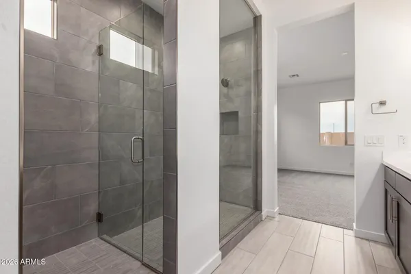 a bathroom with a double vanity sink and mirror