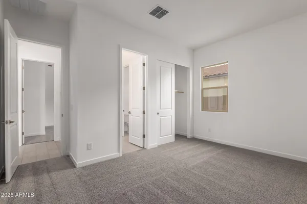 a view of an empty room and wooden floor