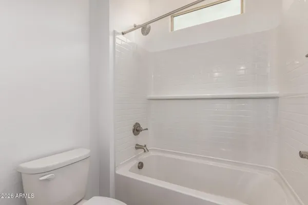 a bathroom with double sink and a mirror