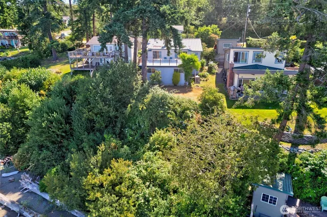 a view of a house with a yard and garden