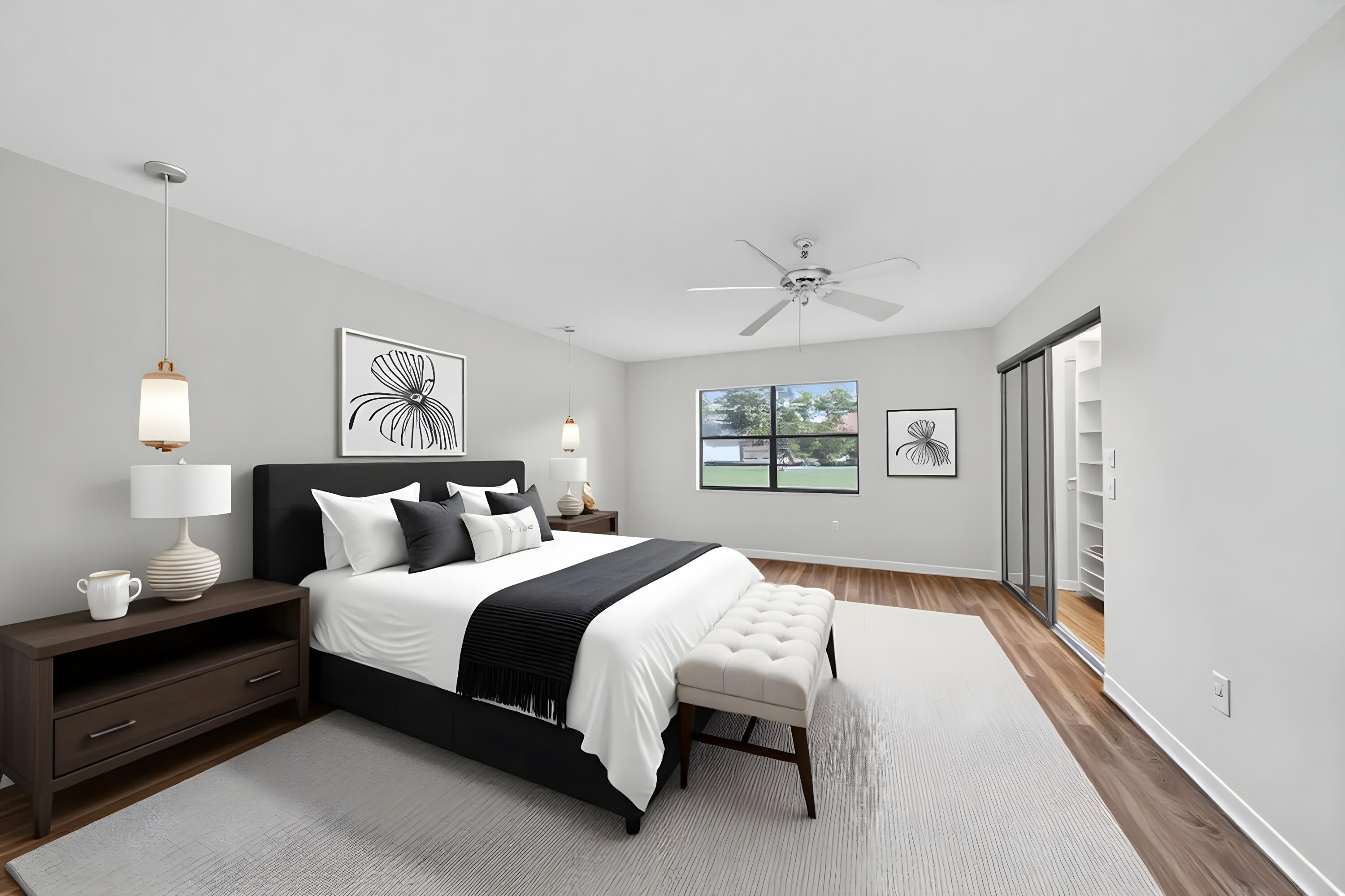 9187 Norte Lago, Unit 5I Boca Raton, FL 33428 - Photo 20 of 37 a bedroom with a bed and a painting on the wall