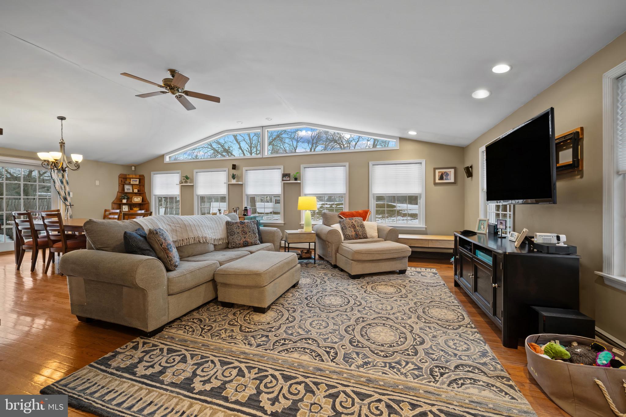 1501 Keystone Drive Hatfield, PA 19440 - Photo 15 of 45 Living room with ceiling fan, a chandelier, and wo