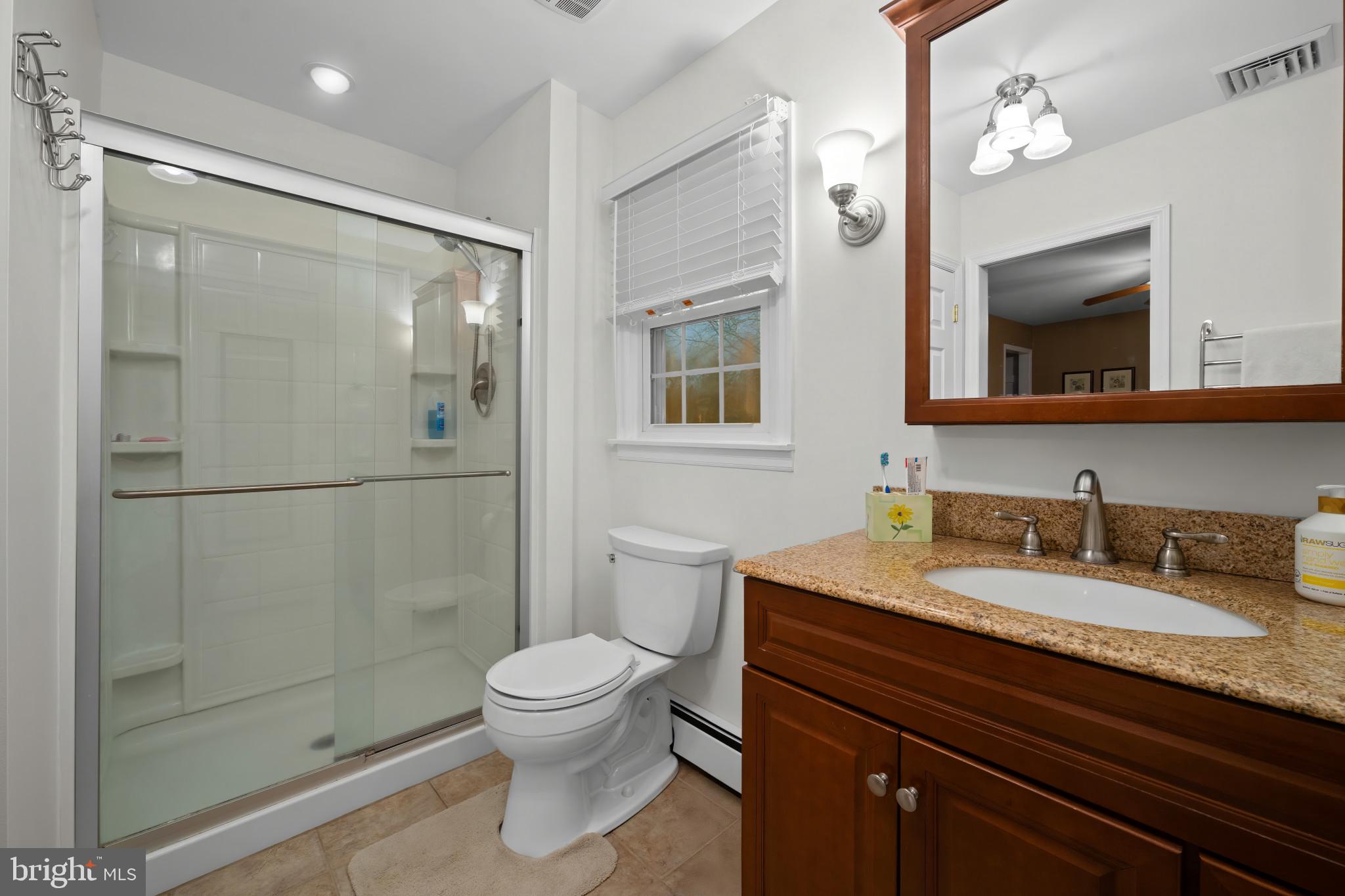 1501 Keystone Drive Hatfield, PA 19440 - Photo 34 of 45 Full bath with vanity, a stall shower, a baseboard