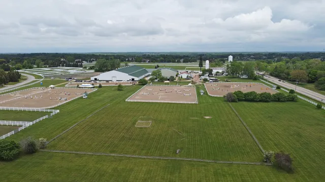 a view of a swimming pool of a house with a yard