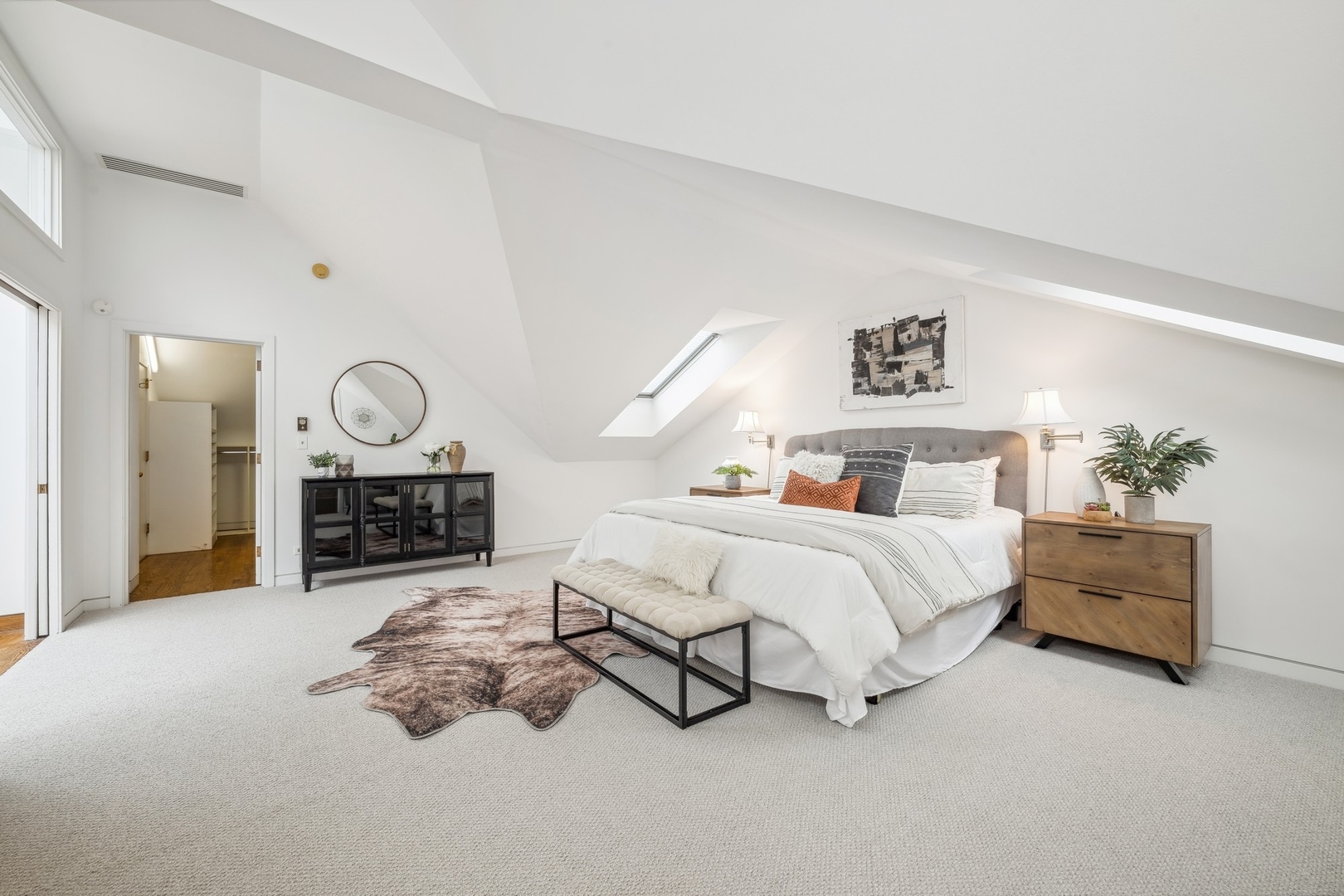 535 North Mayflower Road, Unit D Lake Forest, IL 60045 - Photo 11 of 25 a spacious bedroom with a bed a table and a large mirror