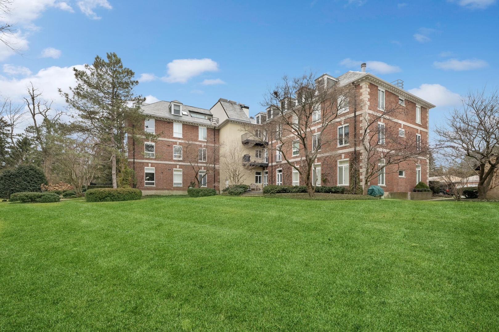 535 North Mayflower Road, Unit D Lake Forest, IL 60045 - Photo 25 of 25 a view of a building with a yard