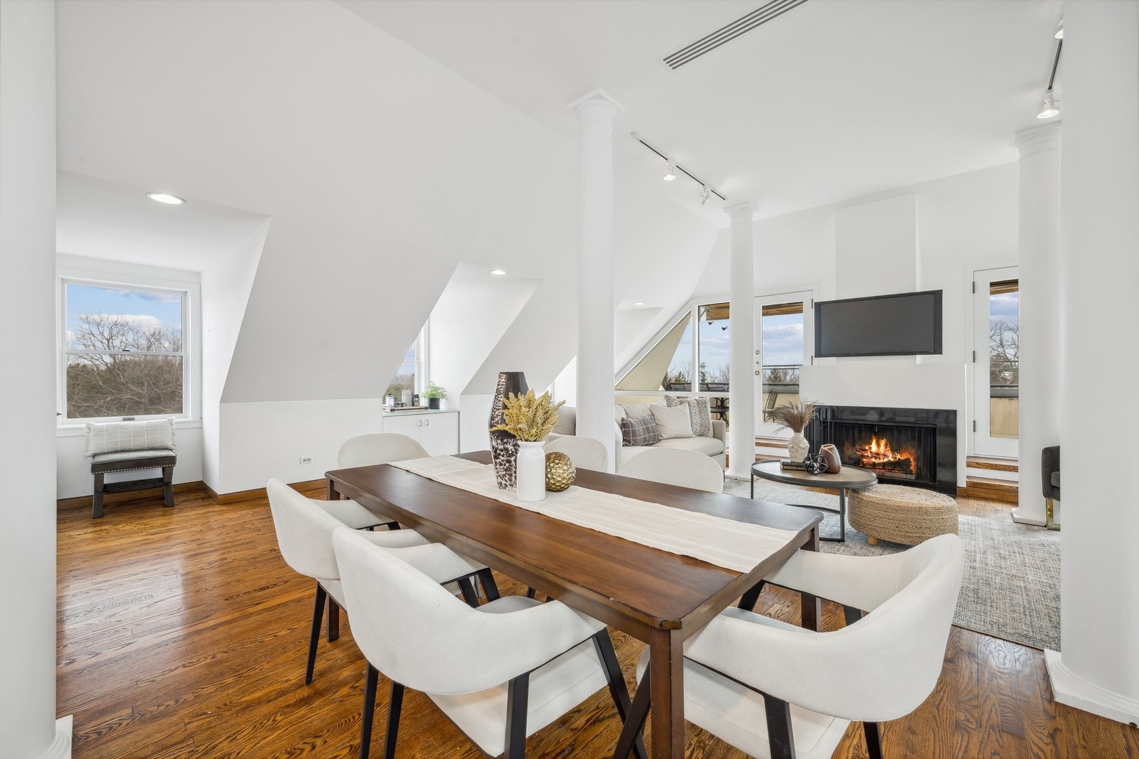 535 North Mayflower Road, Unit D Lake Forest, IL 60045 - Photo 5 of 25 a dinning room with furniture a fireplace and wooden floor