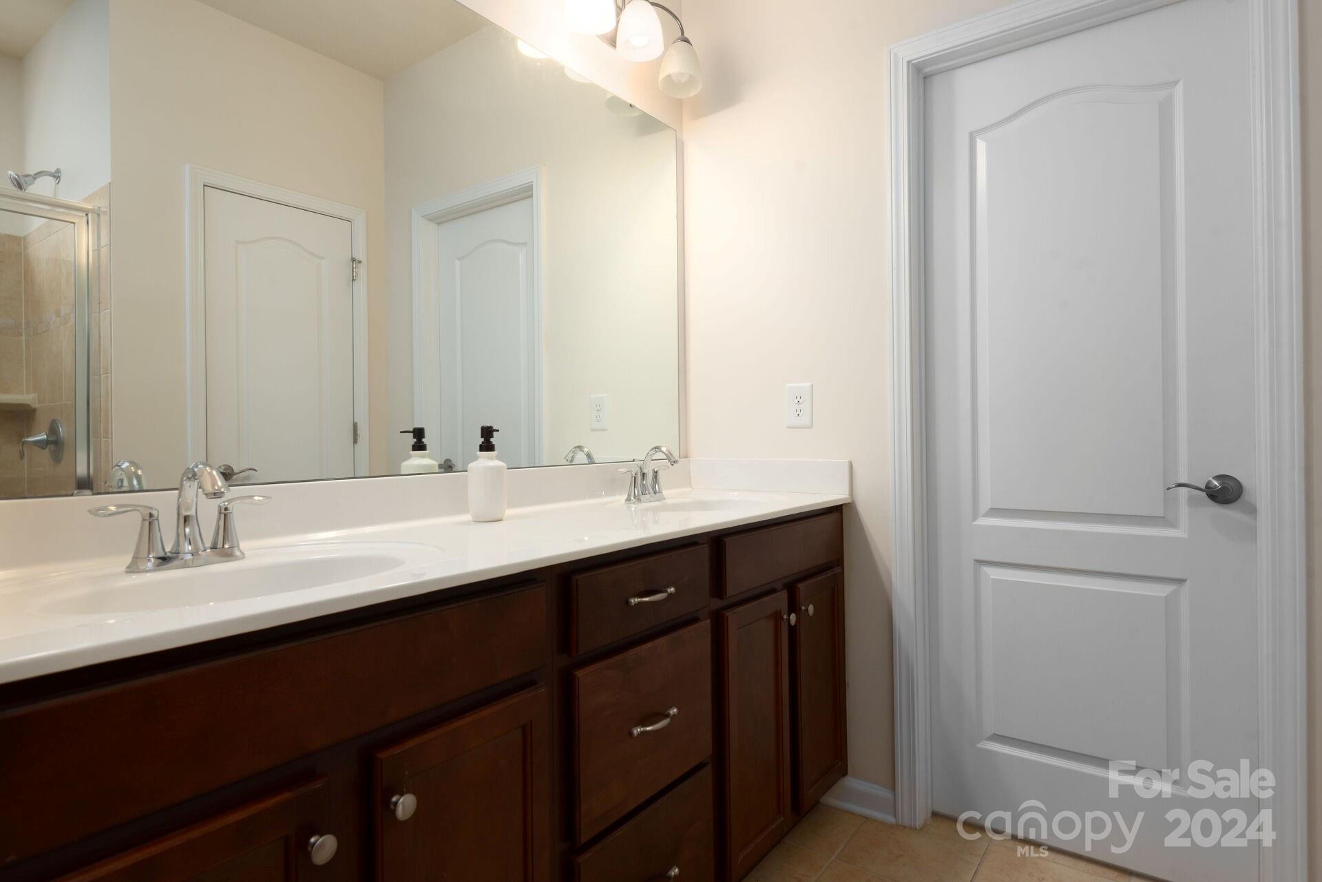 4325 Perth Road Indian Land, SC 29707 - Photo 15 of 33 a bathroom with a double vanity sink and a mirror