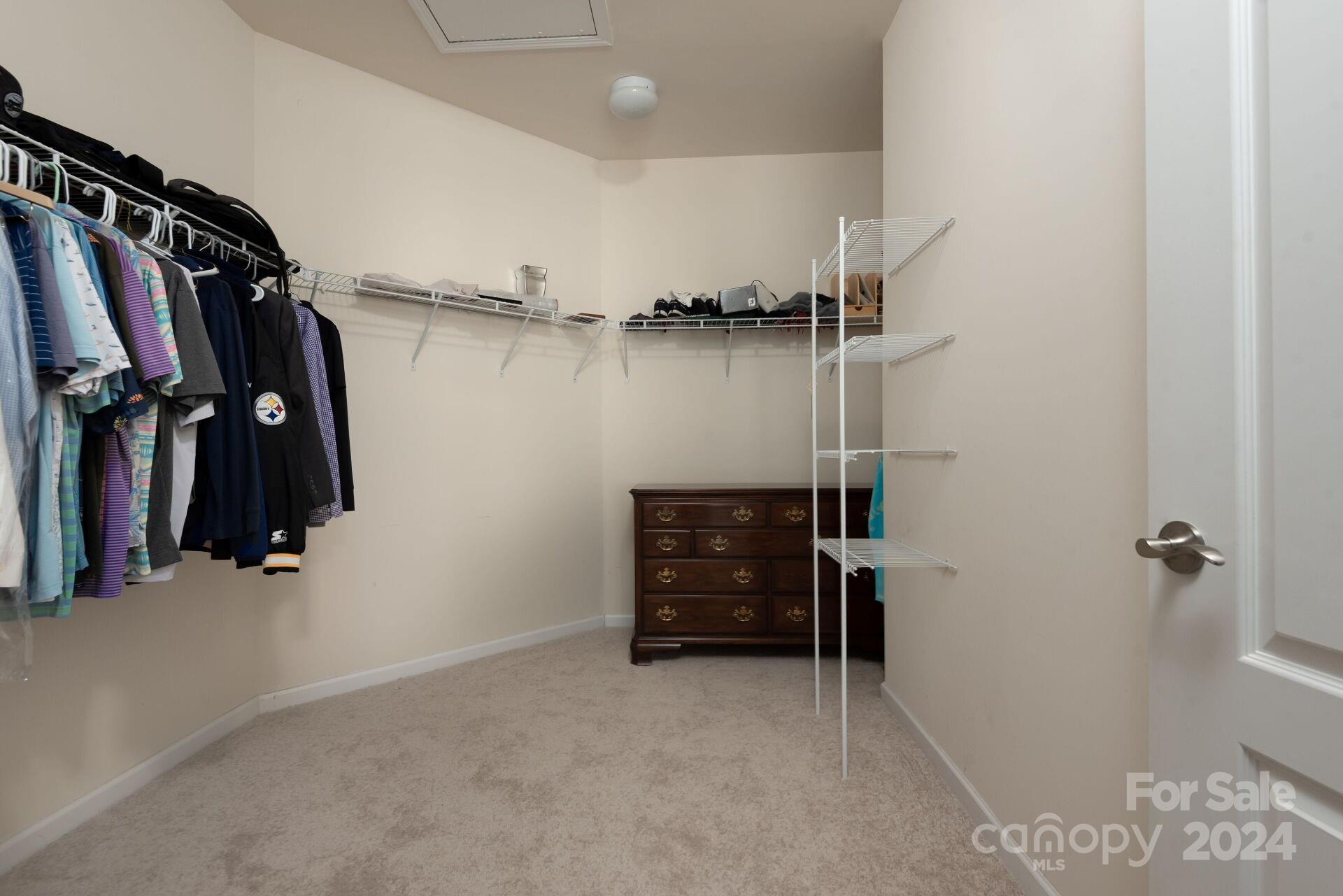 4325 Perth Road Indian Land, SC 29707 - Photo 17 of 33 a view of walk in closet with clothes and shoes