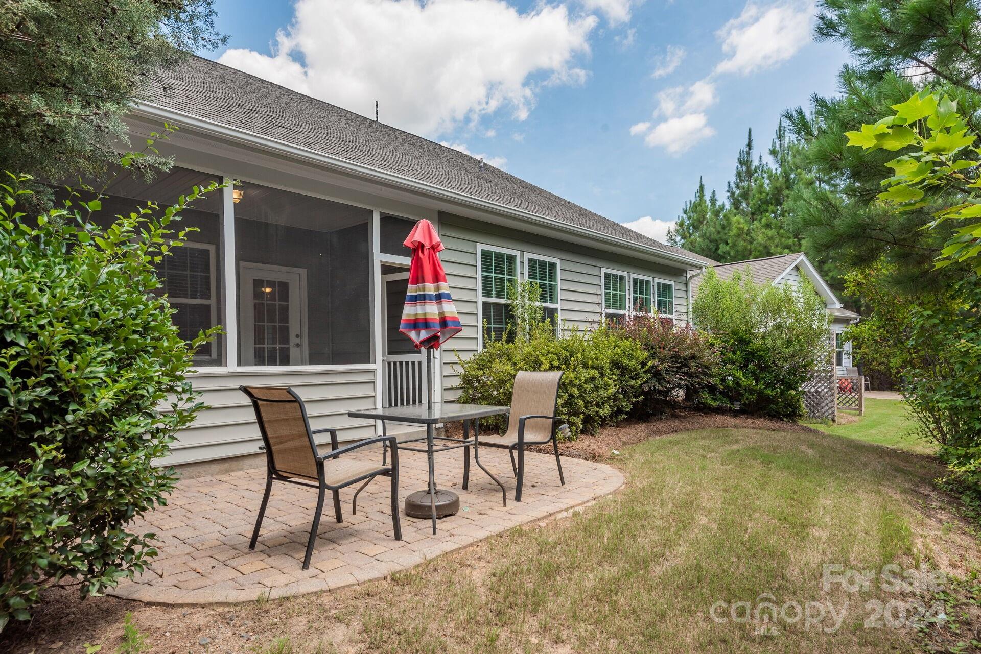 4325 Perth Road Indian Land, SC 29707 - Photo 23 of 33 a view of a chairs and table in backyard of the house