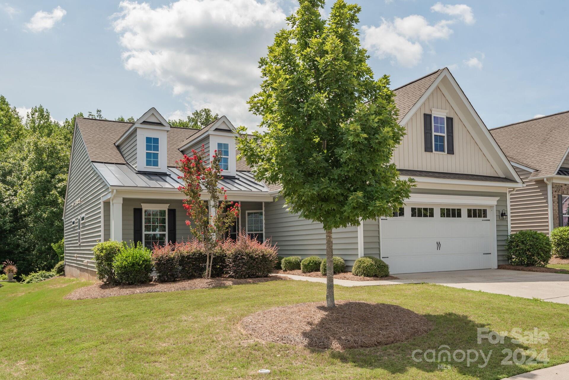4325 Perth Road Indian Land, SC 29707 - Photo 26 of 33 a front view of a house with a yard garage and outdoor seating