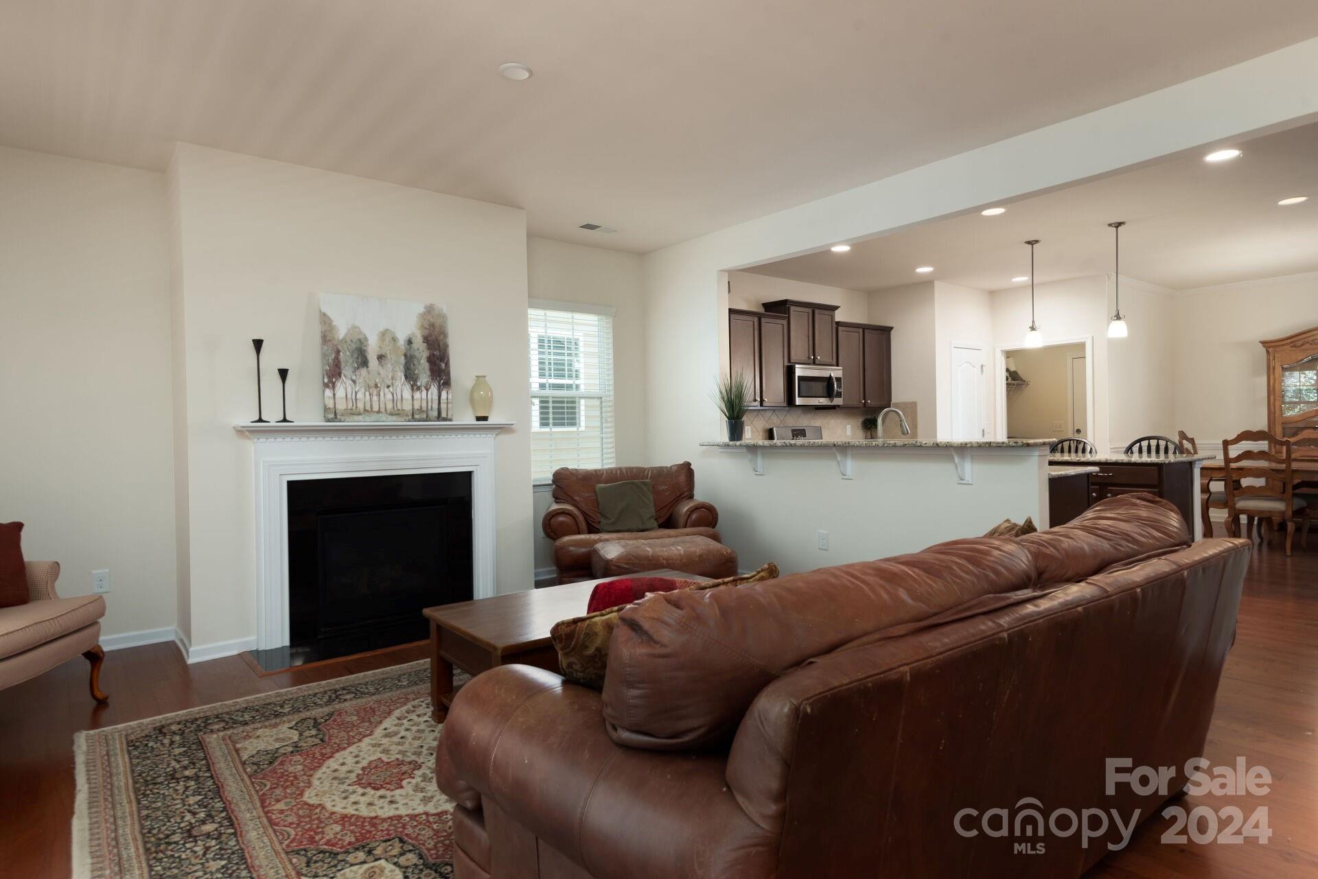 4325 Perth Road Indian Land, SC 29707 - Photo 10 of 33 a living room with furniture and a fireplace