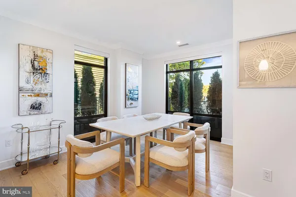a spacious bathroom with a double vanity sink toilet and a mirror