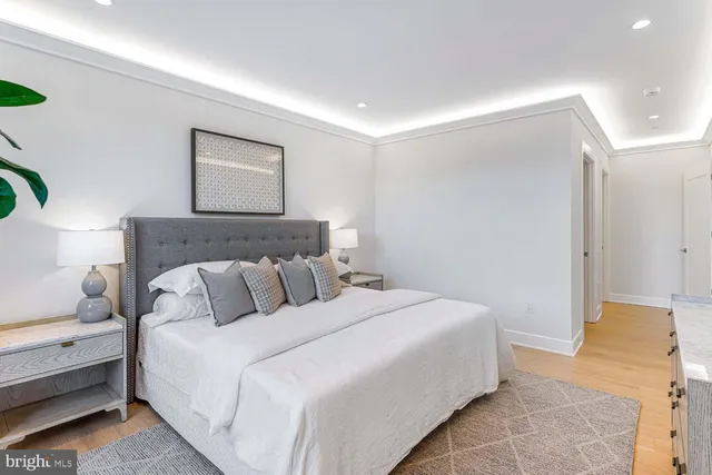 a bedroom with a bed and a dresser