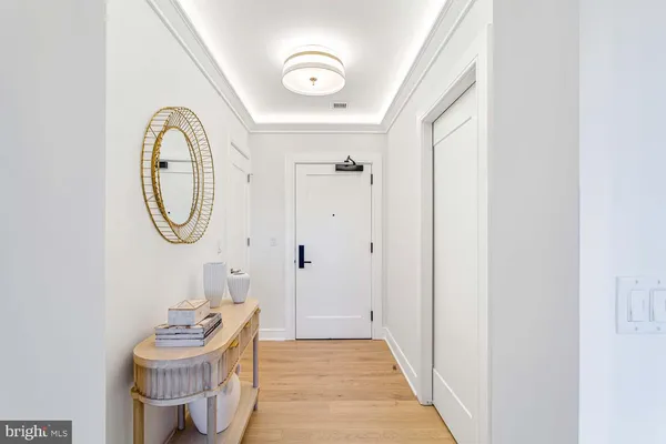 a kitchen with stainless steel appliances granite countertop a sink and a refrigerator