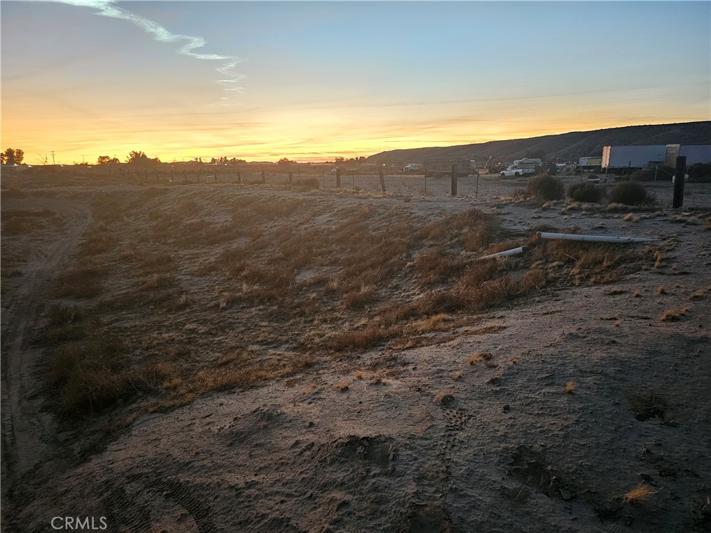 0 Arrowhead Road Barstow, CA 92311 - Photo 5 of 9 a view of a field with mountains in the background