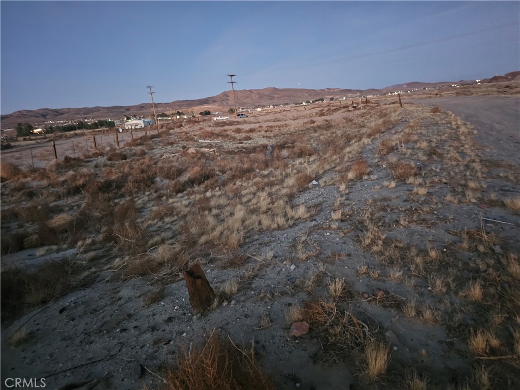 0 Arrowhead Road Barstow, CA 92311 - Photo 6 of 9 a view of a dry yard with mountains in the background