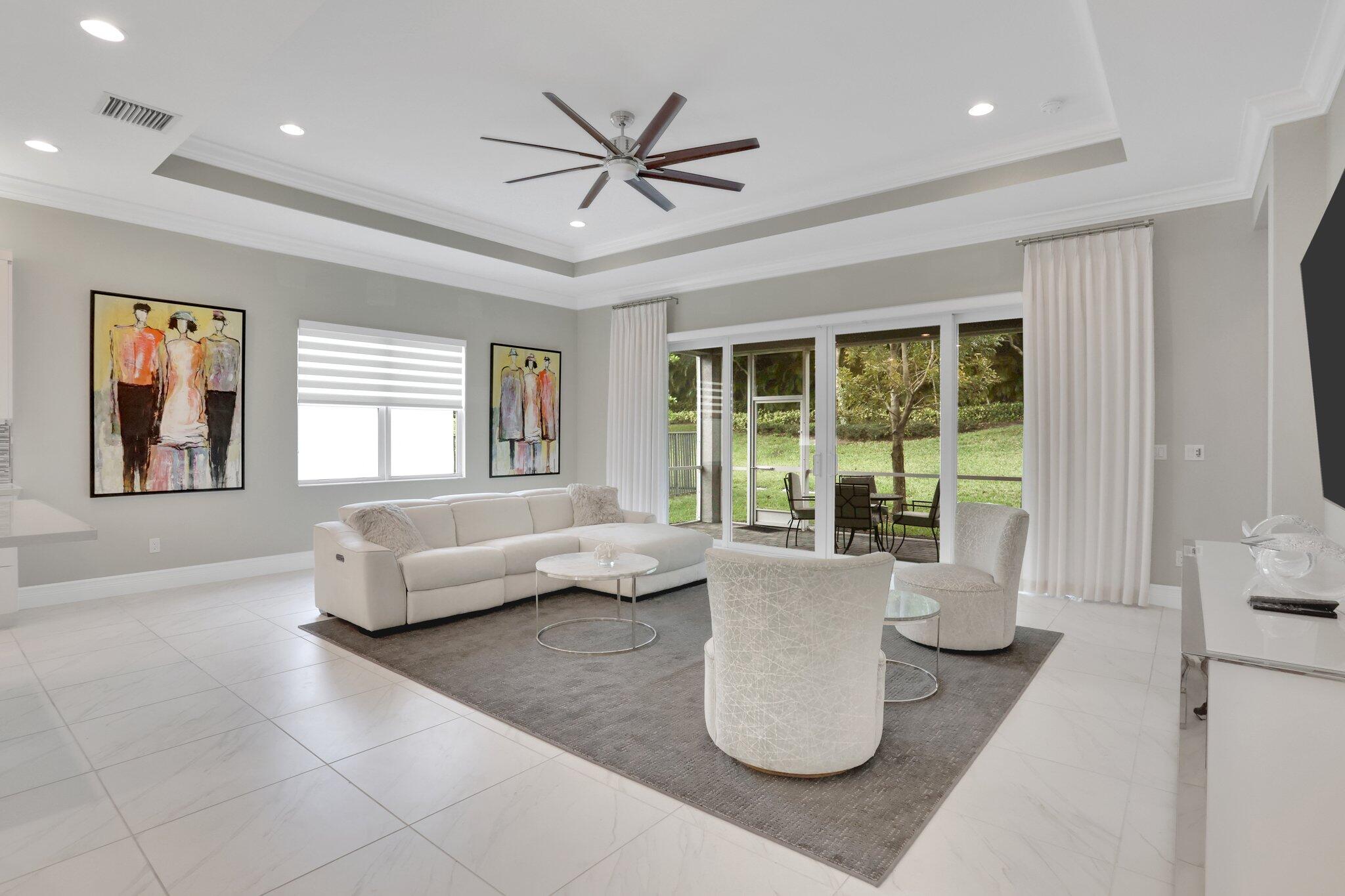 8203 Arabian Range Road Boynton Beach, FL 33473 - Photo 13 of 50 a living room with furniture and a large window
