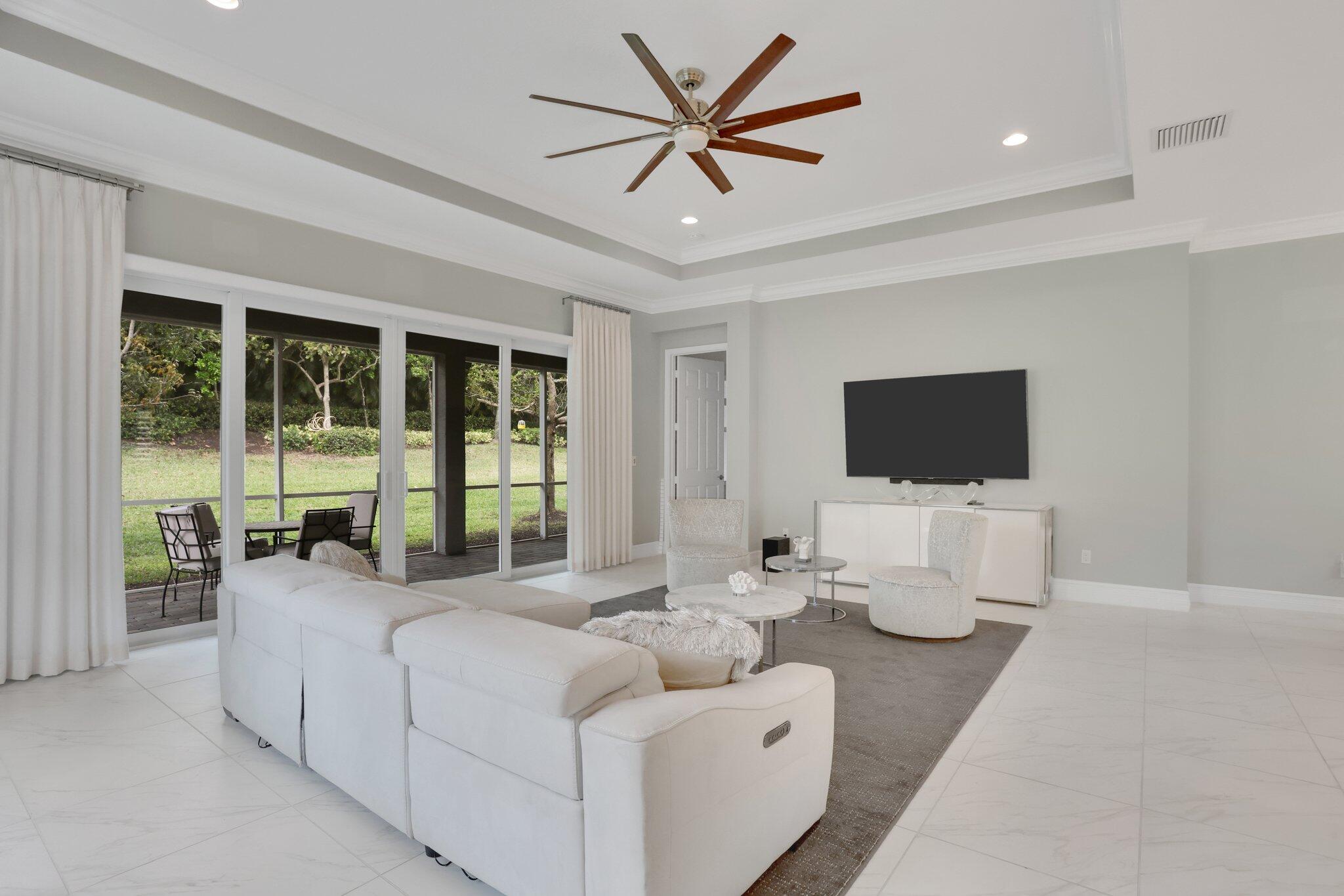 8203 Arabian Range Road Boynton Beach, FL 33473 - Photo 14 of 50 a living room with furniture and a flat screen tv