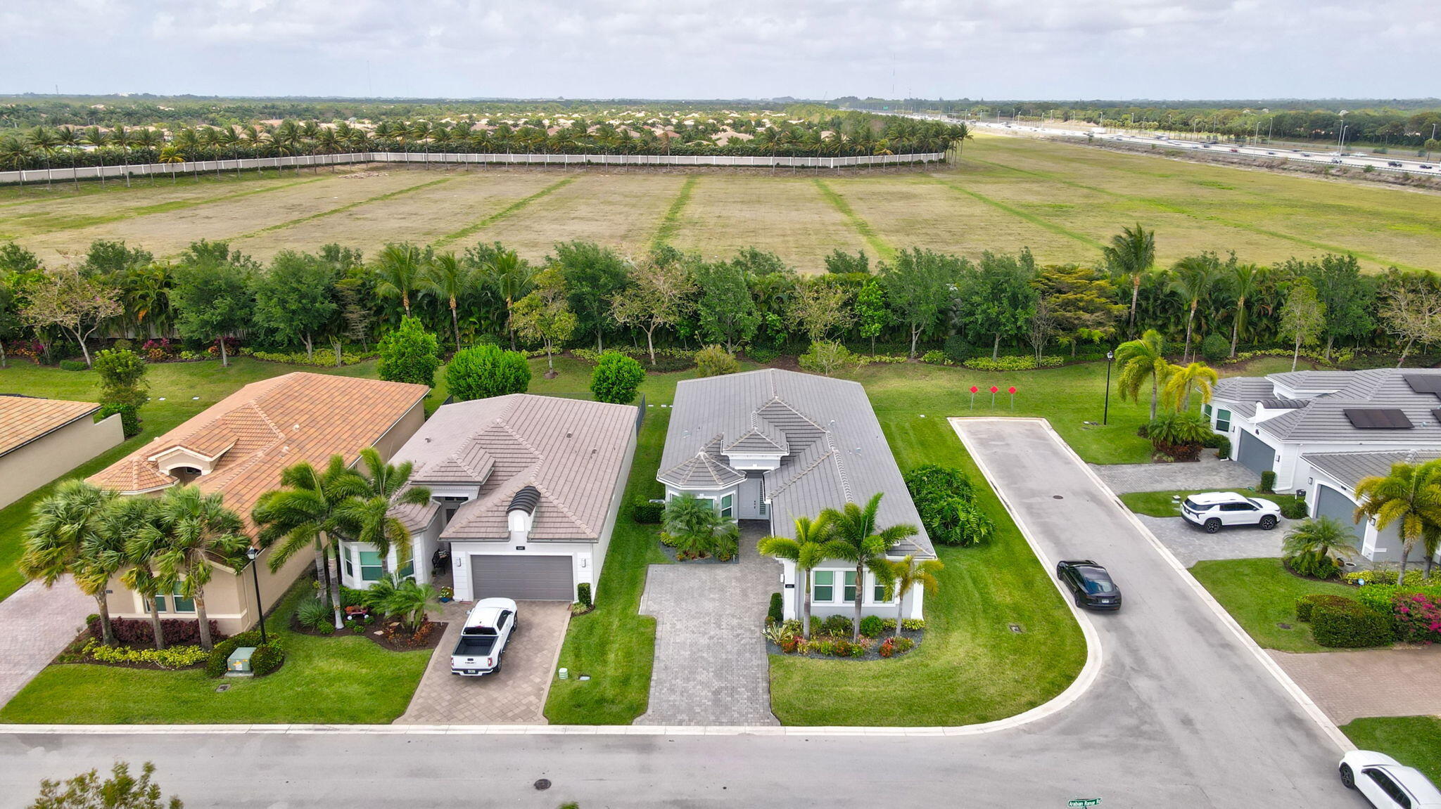 8203 Arabian Range Road Boynton Beach, FL 33473 - Photo 2 of 50 an aerial view of a house with outdoor space and lake view