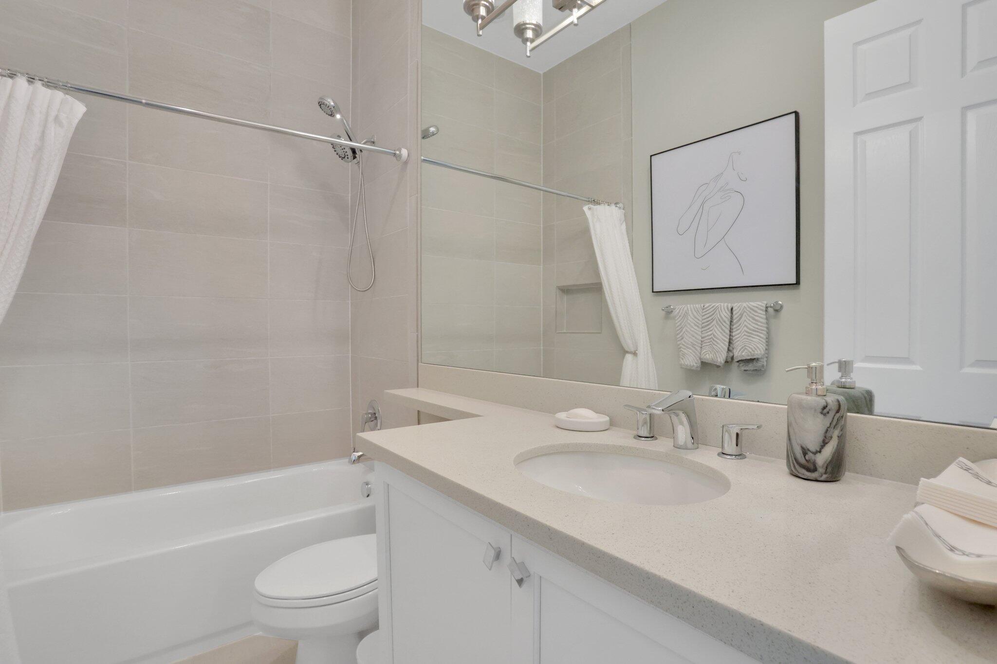 8203 Arabian Range Road Boynton Beach, FL 33473 - Photo 21 of 50 a bathroom with a sink a toilet and shower