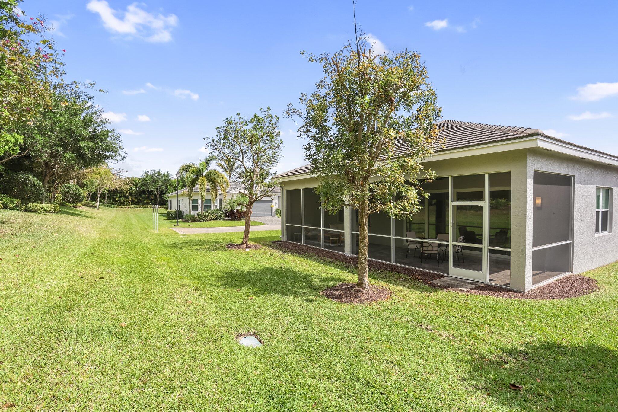 8203 Arabian Range Road Boynton Beach, FL 33473 - Photo 31 of 50 a view of a house with backyard and garden