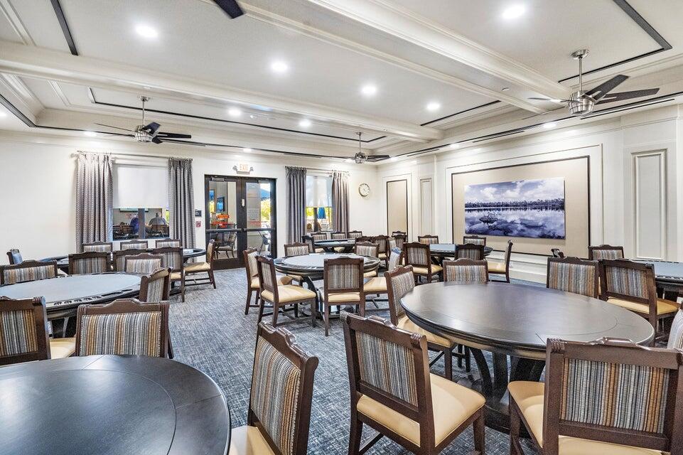 8203 Arabian Range Road Boynton Beach, FL 33473 - Photo 38 of 50 a dining hall with lots of tables and chairs