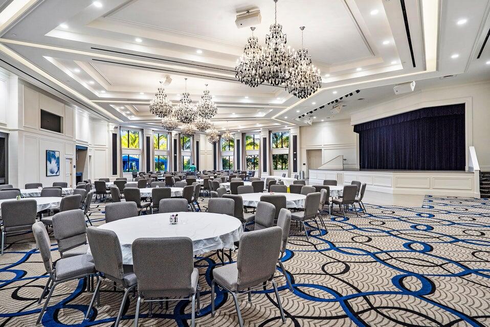 8203 Arabian Range Road Boynton Beach, FL 33473 - Photo 42 of 50 a view of a dining room with furniture a chandelier and kitchen view