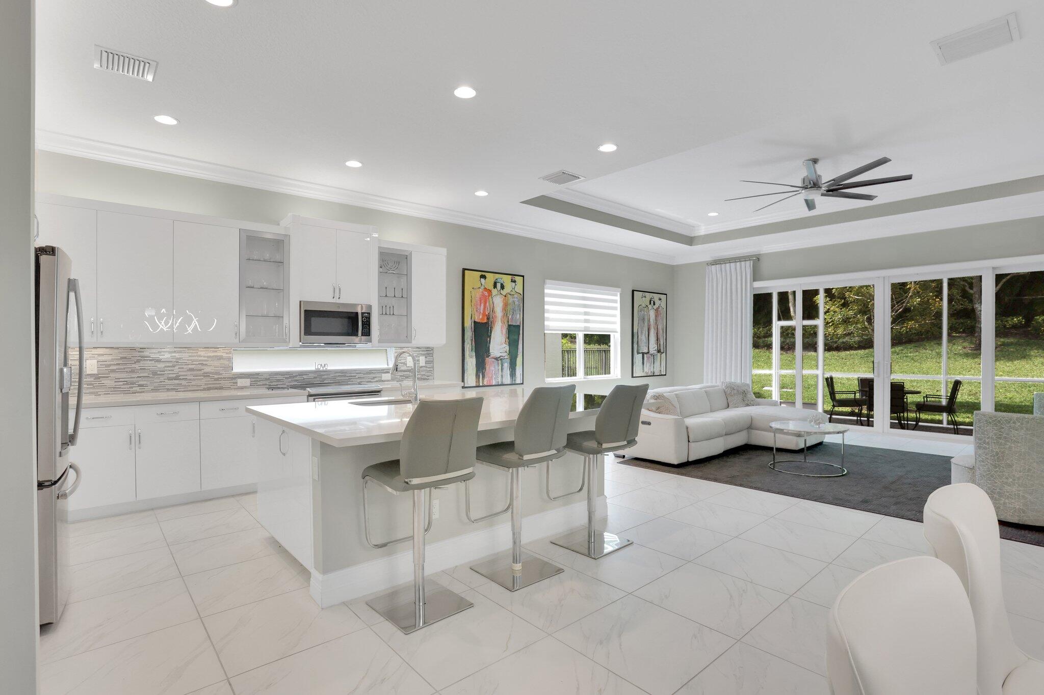 8203 Arabian Range Road Boynton Beach, FL 33473 - Photo 8 of 50 a living room with granite countertop furniture and a fireplace