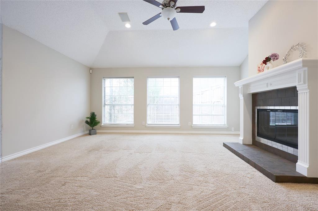 8112 Dock Street Frisco, TX 75035 - Photo 10 of 34 a view of an empty room with a fireplace and a window
