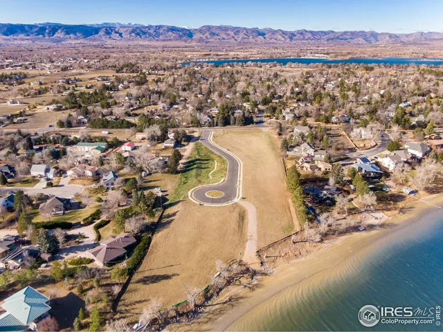 an aerial view of a house with a lake view